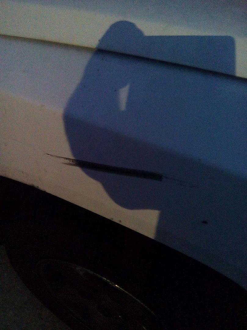 So just took this pic of my truck, see the black mark? Well 2 days I was driving on Roseville Road by HD where the road goes from  2 lanes to 1, I was in the left lane that was good, the right was disappearing! There was a 