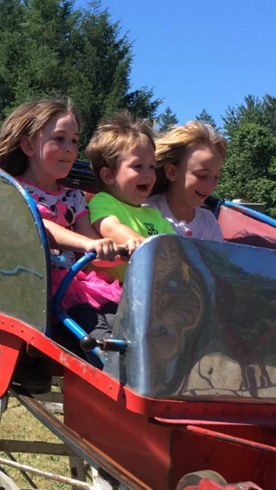 The grands were liking the roller coaster at Amboy Territorial Days. At first, Thomas was wondering, what did I let my sisters talk me into this time!