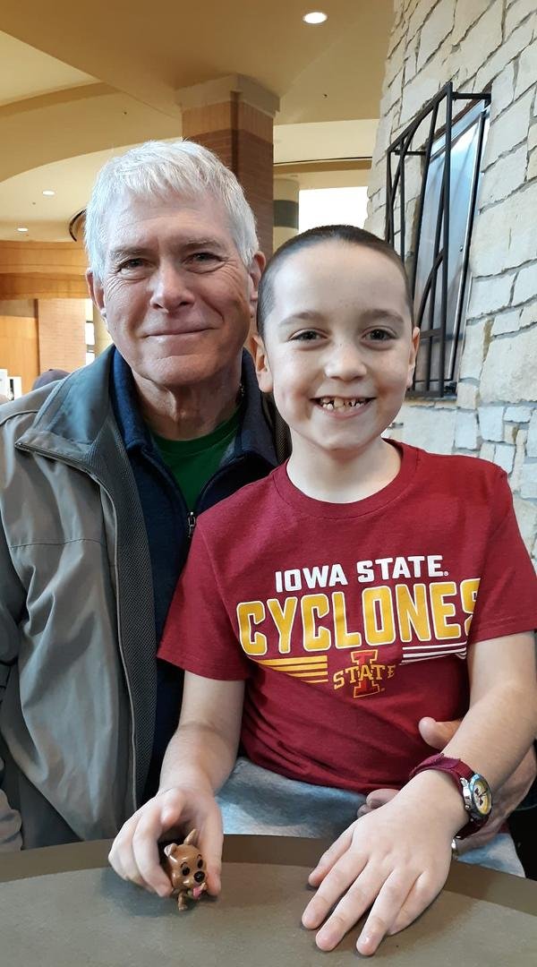 Well at least one of us still has hair.