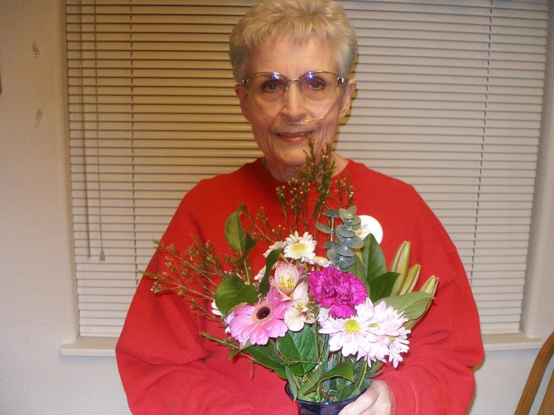 Wearing my red shirt for Kerri Saikin and holding the flowers my hubby gave me for my birthday.