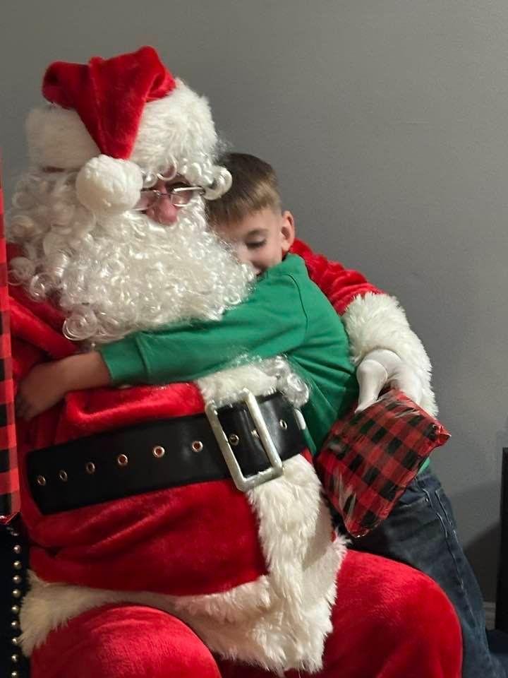 It’s all worth it when Santa gets a big hug from the youngest grandchild!!