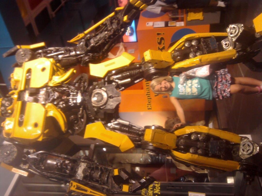 AUGUST 24,2012 CAITLIN posing in front of Mechanical Robot..
