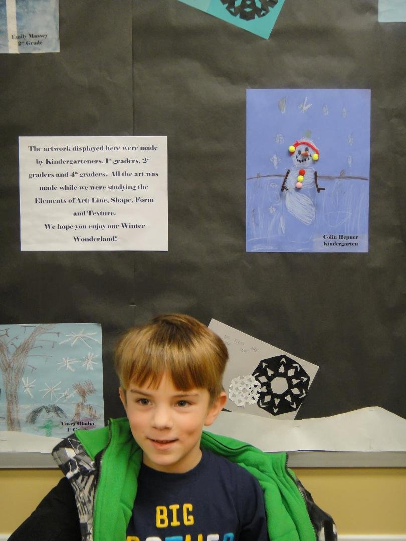 Colin with his artwork that is on display at the District Office :)