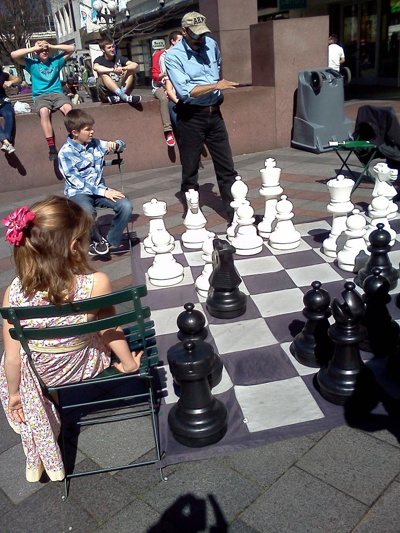 Playing "big boy" chess in Westlake Center, Seattle.
