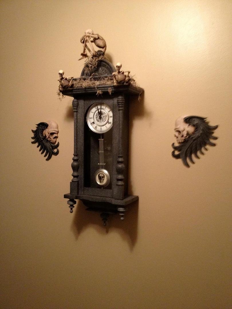 My new Halloween clock....It was an old cherry clock I have had for over 30 years... a little stain, paint and skeletons...and Walah....