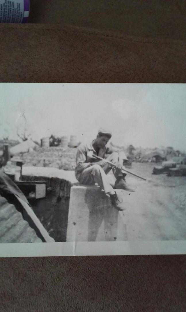 This is our Dad in the Marines during WW2. He was carving a cane we had for many years in our house.