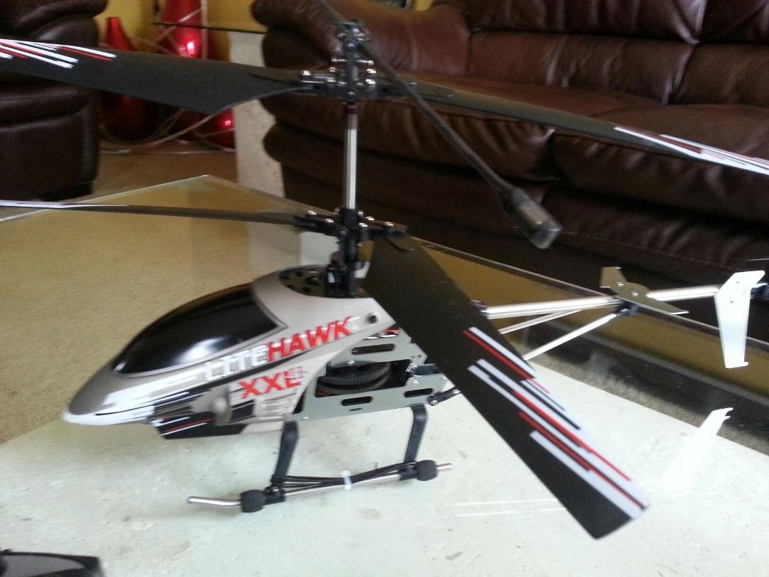 I was shopping for Christmas Presents years back and this guy in PoloPark was flying one around....it was so cool. Since then I have always wanted an RC Helicopter. Well temptation finally got the best of me yesterday an