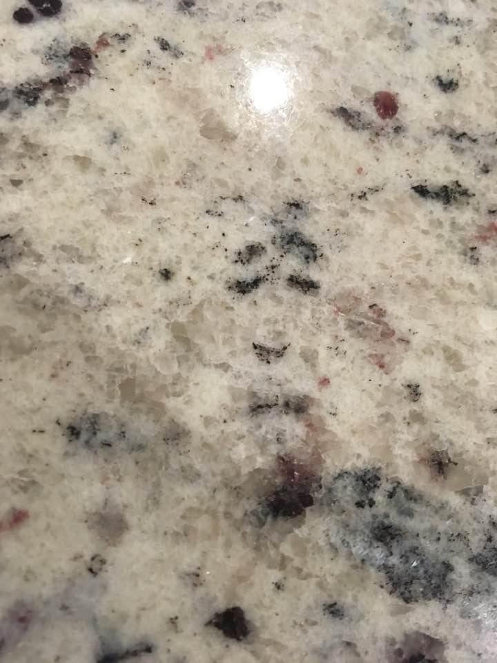 Sitting at the island for about the 500th time having a cup of Coffee. Happened to look over and saw this in the Marble. Watching me. Creepy. My daughter said Jesus. Could be ?