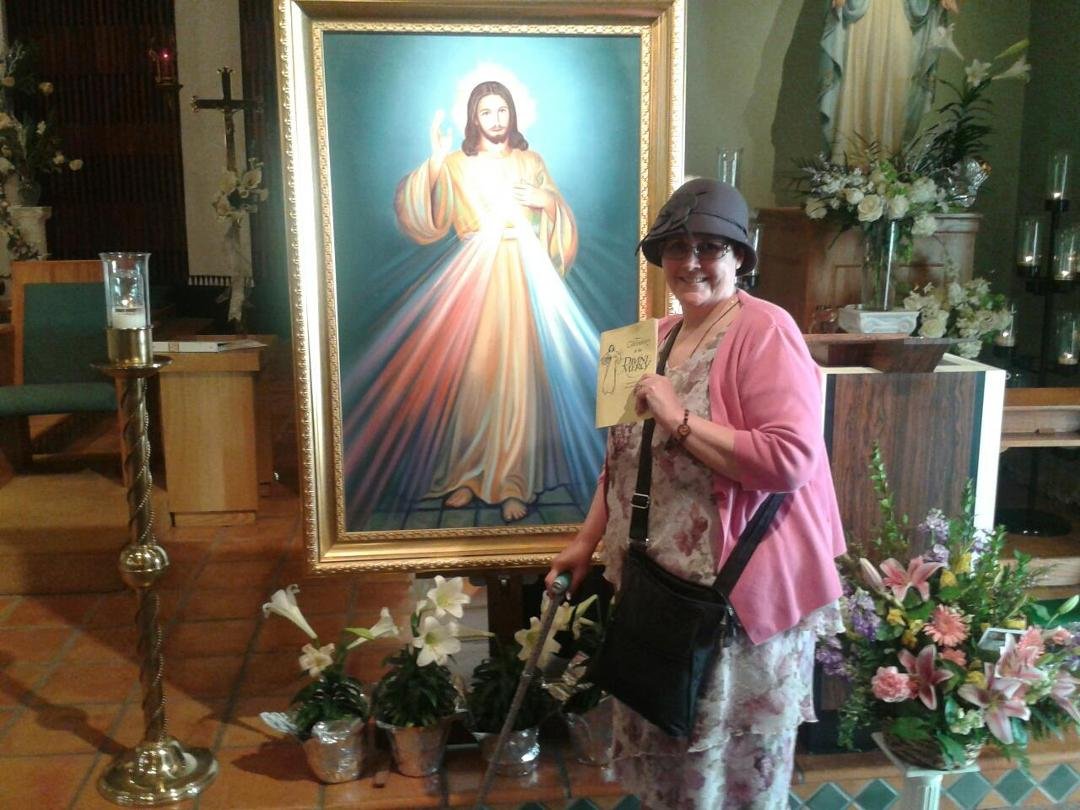 Michelle with image of the Divine Mercy at Annunciation Catholic Church in Arcadia, CA.