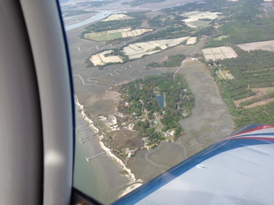That green blob in the middle of the picture is the site of our new home. Our house is in the trees beside the top left corner of the pond in the middle of the island.