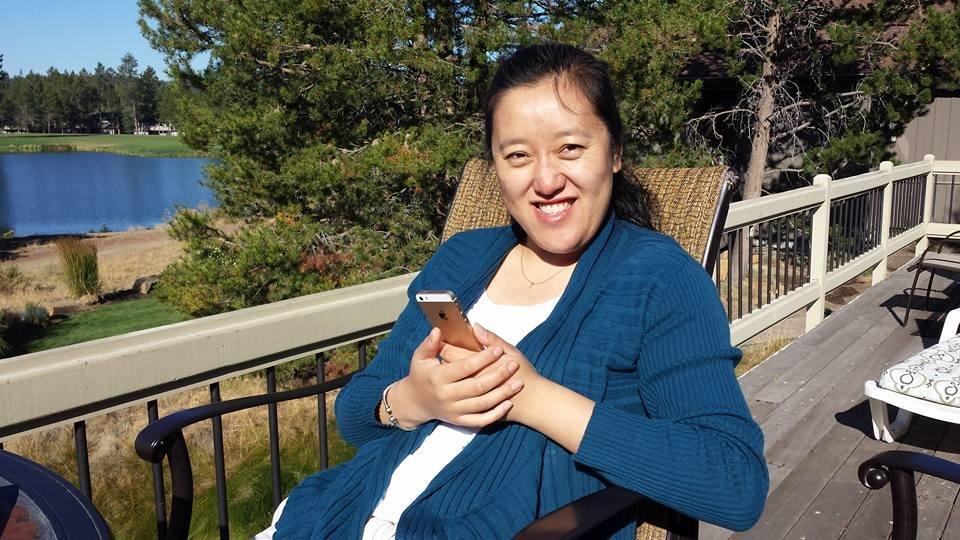 Jane on the deck by the lake on Monday