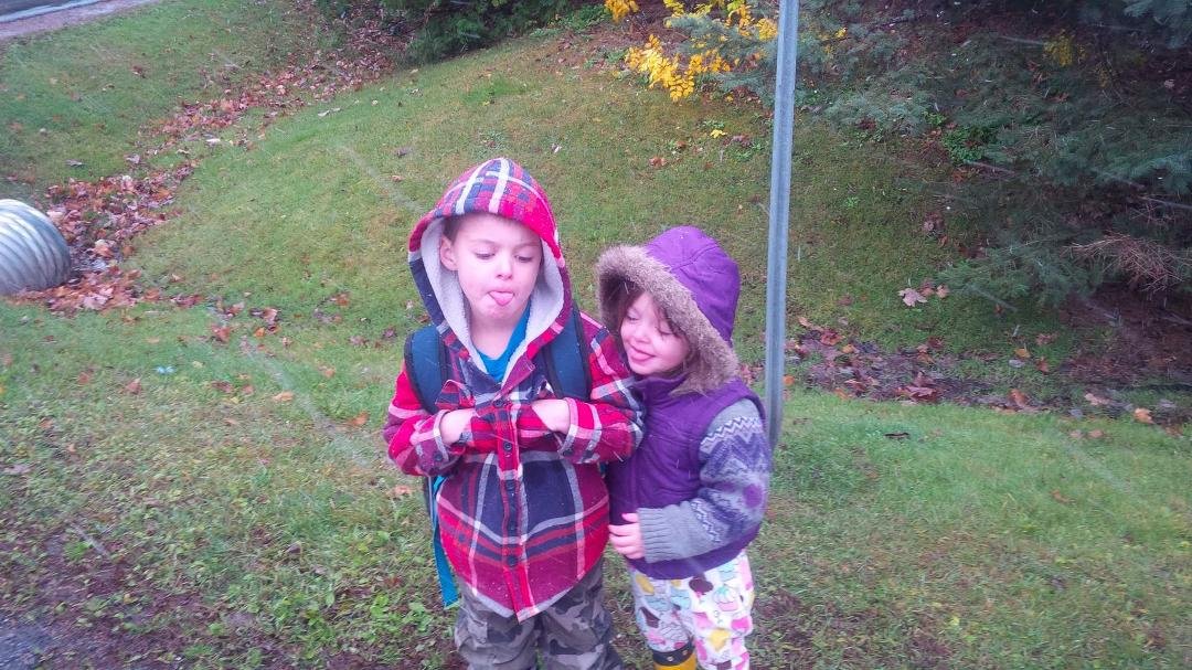 Got to put Logan on the bus for the first time. And it was snowing so they were trying to catch snowflakes on there tongues... love you both