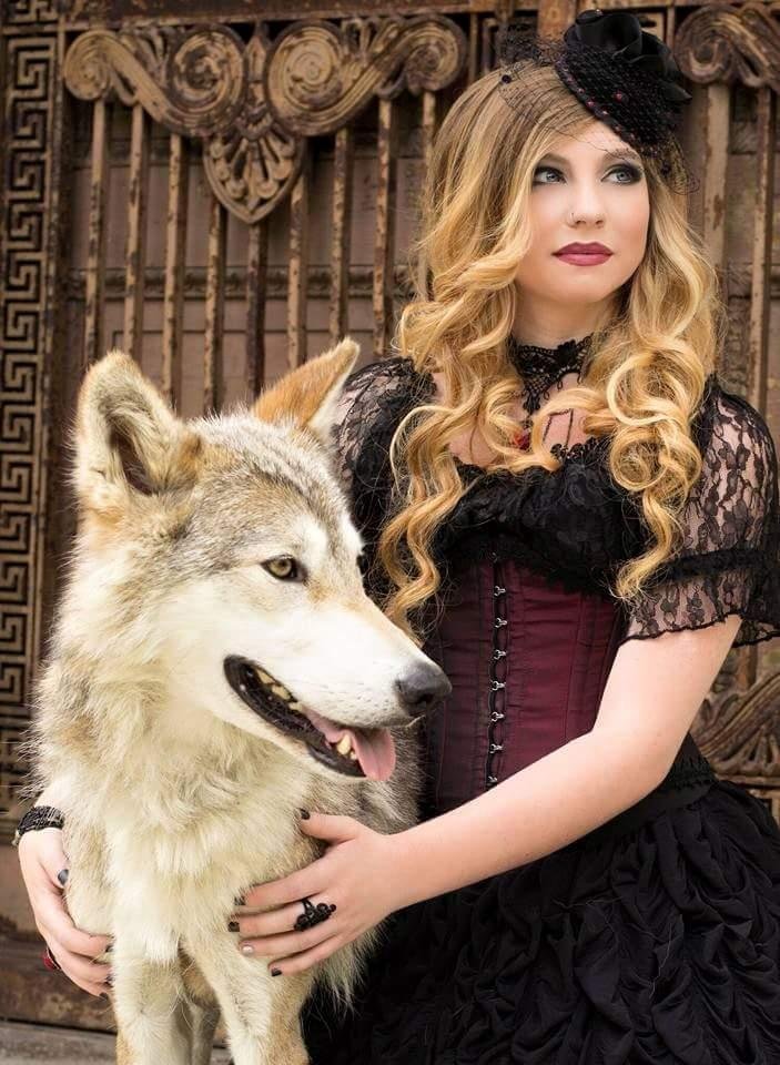 Here she is....Miss Hannah's senior picture taken with a wolf......our Miss Independent marching to her own drummer!