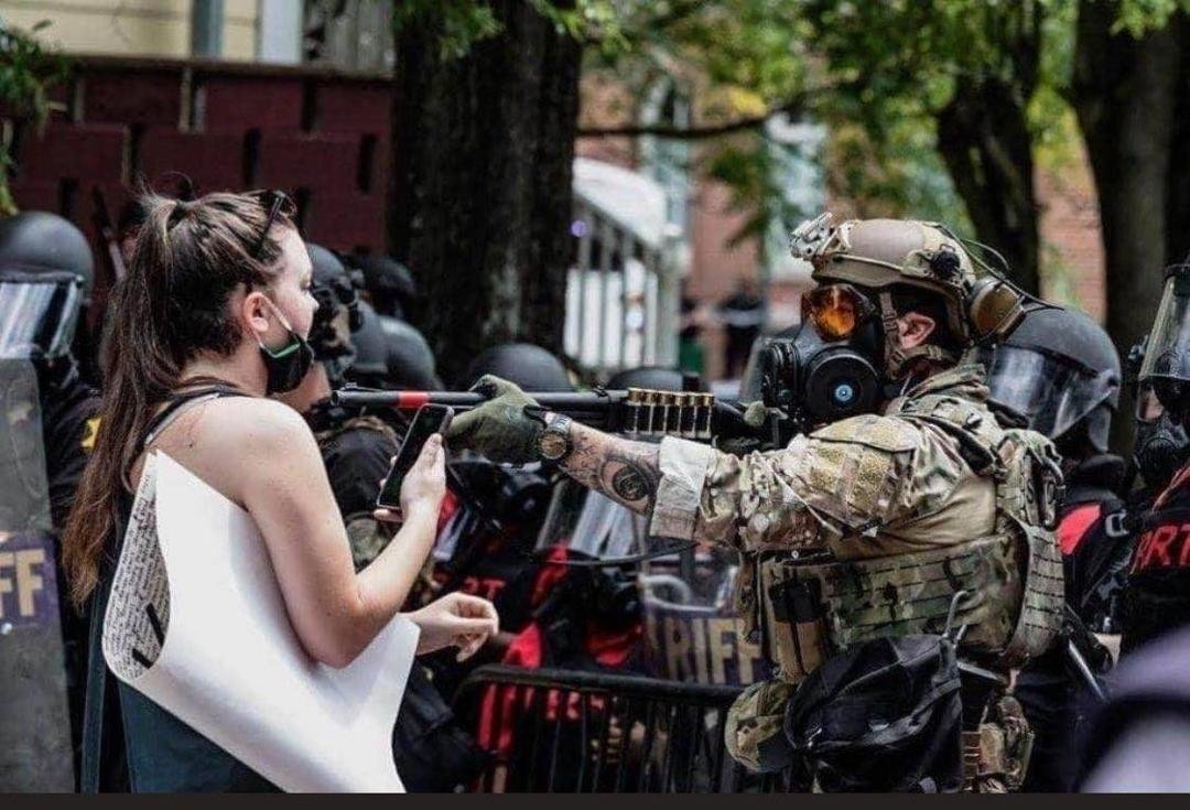 In New Jersey, the act of pointing a firearm at someone is a crime.  If that's true there, the goon should be arrested and prosecuted, at that range anything discharged from that gun barrel aimed at her throat would be dead