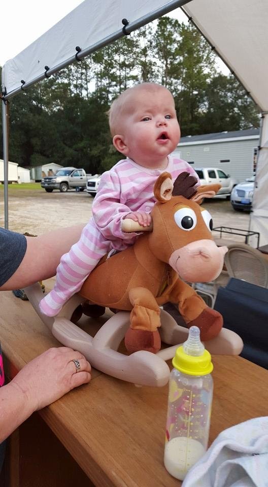 She is riding.