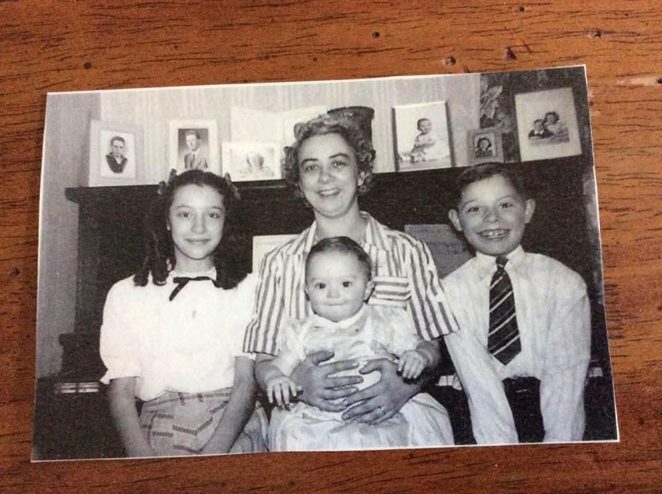 I found this photo of my sister, mother, brother and me, the baby. I just love the expression on my brother's face. This was probably taken in 1948.