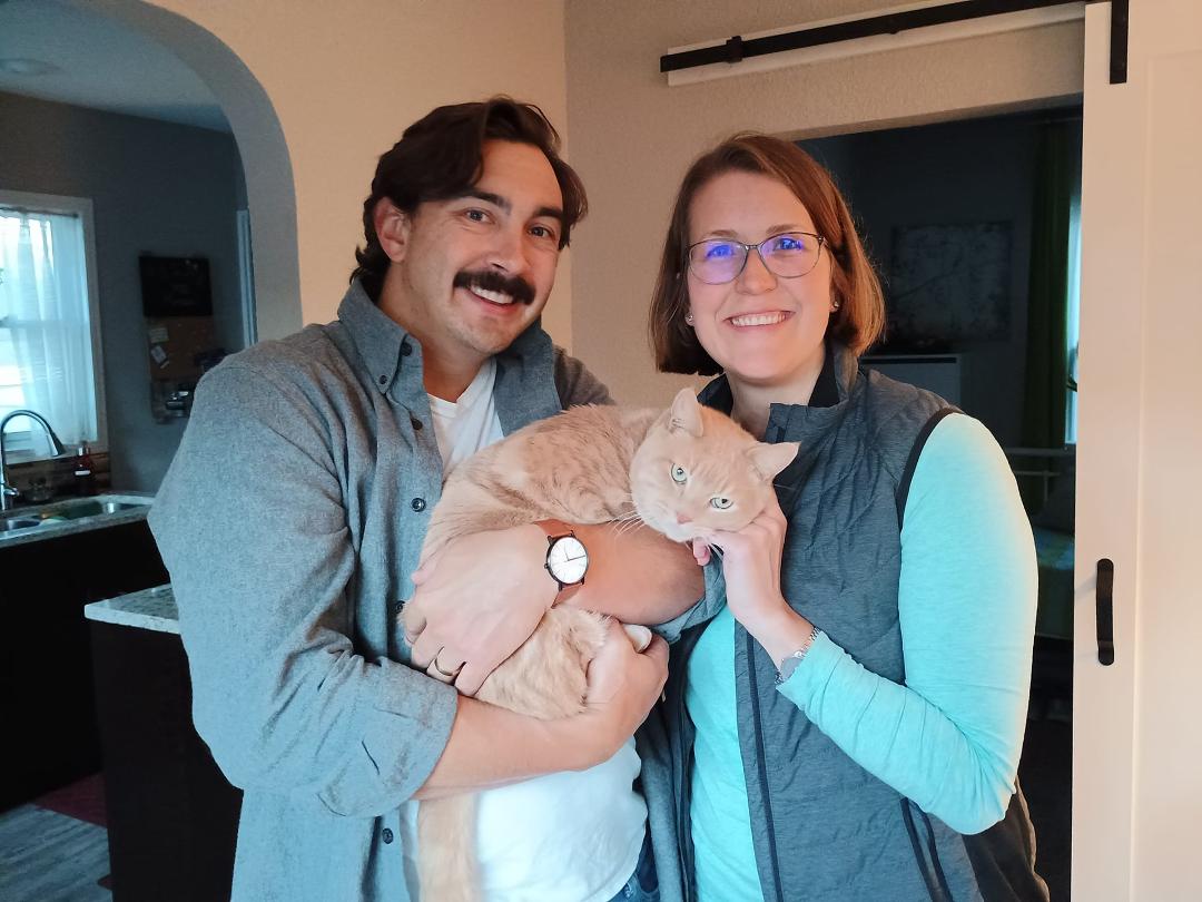 Walker, the handsome polydactyl, with his forever family.