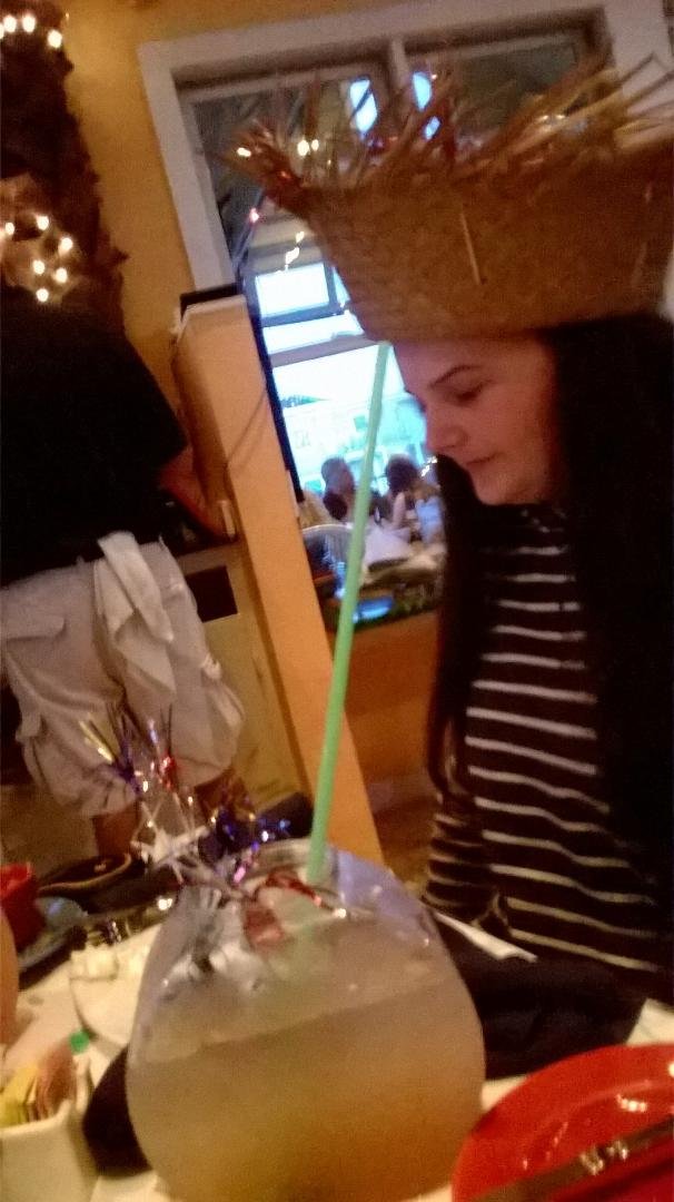 At the beach and Mango Mikes celebrating Sarah's birthday with a hat and drinks in fishbowls.