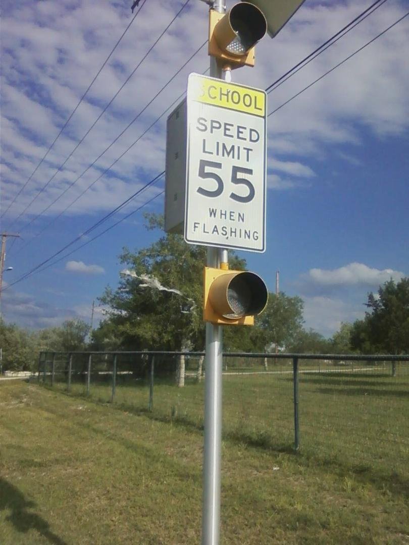 School zone sign near San Antonio, TX. I guess if you are a flasher they don't want you lingering near the school....