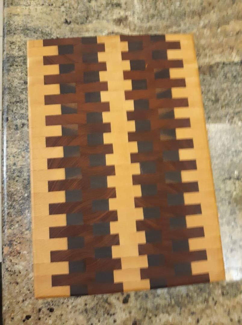 This is a little bit better picture of the cutting board. Still looks good. It was made of maple, mahogany and walnut and is about one inch thick and 11X15. A nice size.
