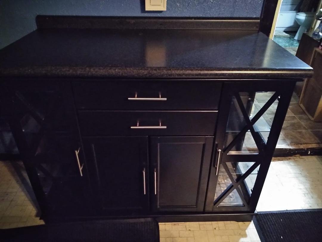 Billy got the board back on the wall, same place, perfect height, no re-painting. Countertop on.Now I can cook and stuff over my buffet. Thanks Son