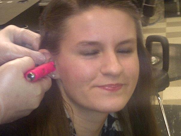 Kalsie getting her ear pierced.