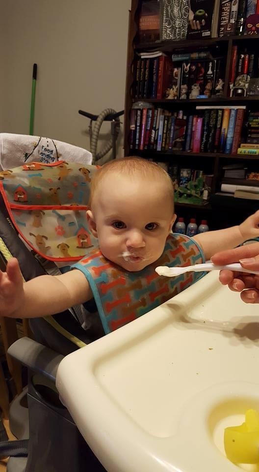 Mommy feeding Hunter baby yogurt as you can see on face he loves it !!!