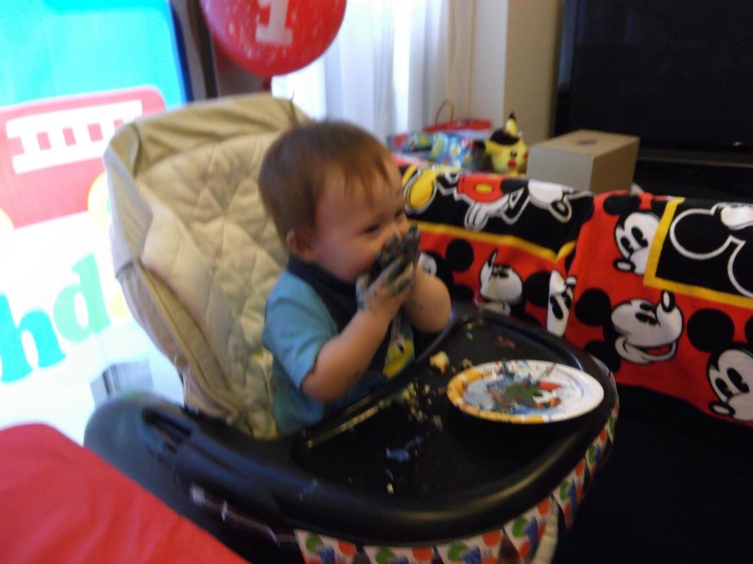 Kay enjoying his "1st" Birthday cake Sept 16 2012