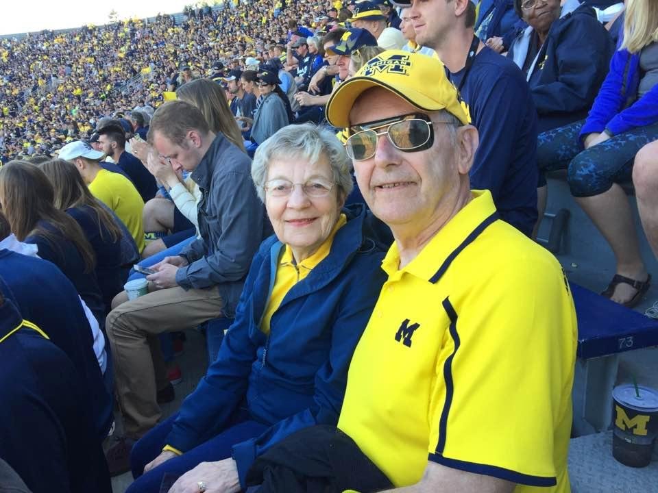 A cute couple we met at the game. Luckily I was standing up behind her when she missed a step. I was able to catch her as she was falling backwards. No harm. No foul.