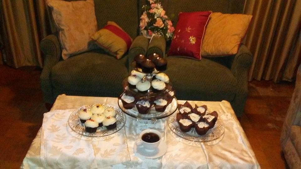 Celebrating Prince Harry and Meghan Markle's royal wedding with royal wedding cupcakes from Sprinkles and Buttercream Bakery.  The first tier is Sprinkles' chocolate marshmallow filled with ganach frosting and ring decorati