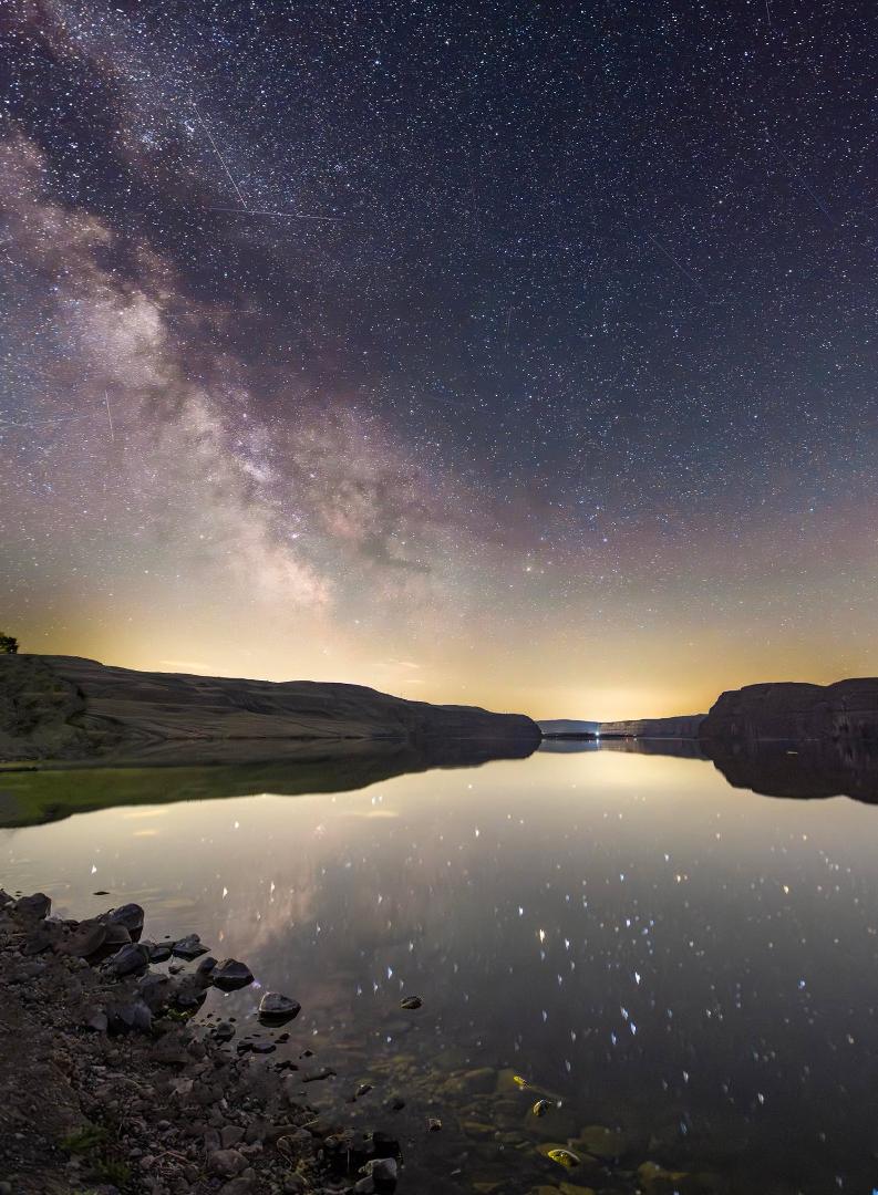 Last night I ventured to one of the darker sky regions of Washington State to capture the heavens above the basalt cliffs that surround Jameson Lake, and the reflection of it all.
I was greeted by a family of geese with l