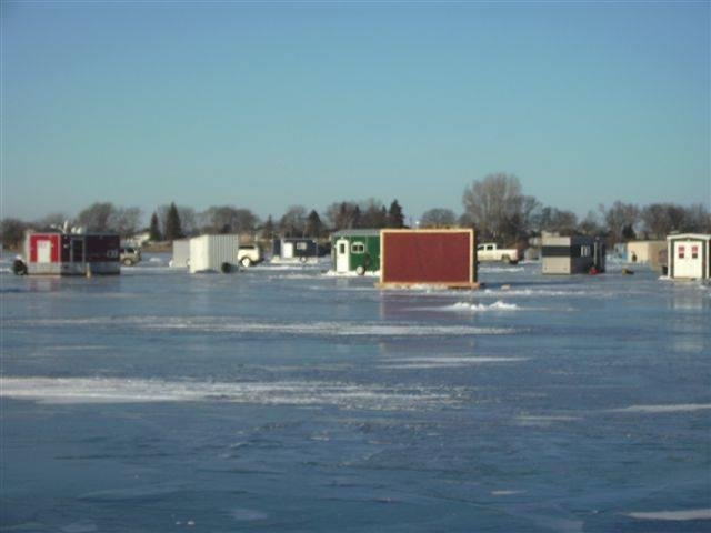 We went from no company to too much company..... I checked the ice today and it is 28 inches thick..... If it gets any thicker I'll have to put a extension on the auger....This picture is on Lake Lida.... There is a bar res