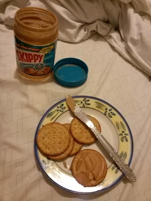 It's official....I am my dad! Peanut butter and crackers..working with what most people would consider an empty jar of Skippy but he and I know how to get all the goody out of it! Love my dad and mom..miss you both. Will be