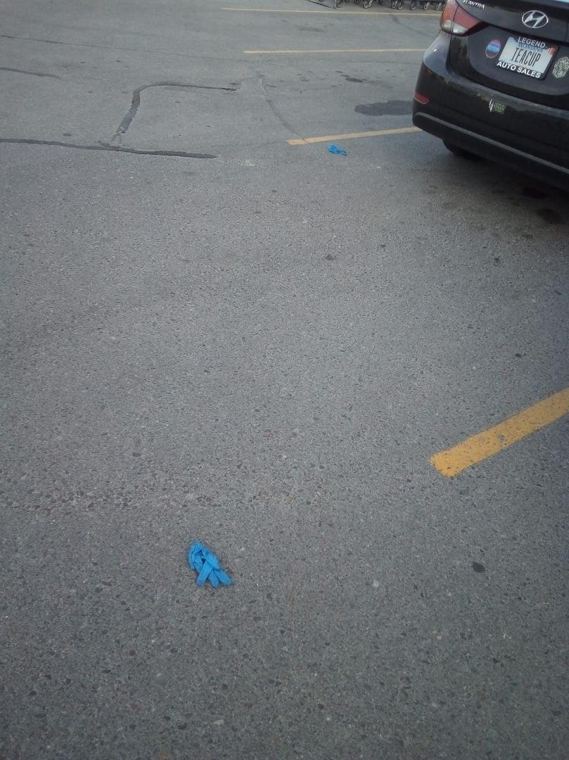 Come on people. People got to get it together throwing use gloves on the ground in a parking lot I mean come on when does the stupidity stop.