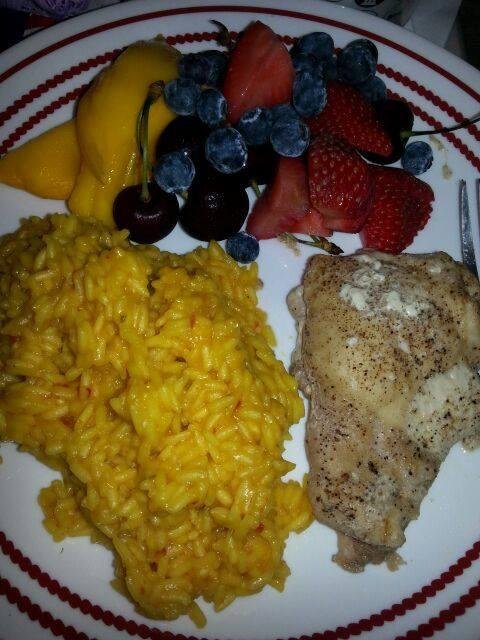 Tonght's dinner yellow rice chicken and fruit. Boy Dakota is getting some good dinners lately. He just has pineapple i have different fruits.