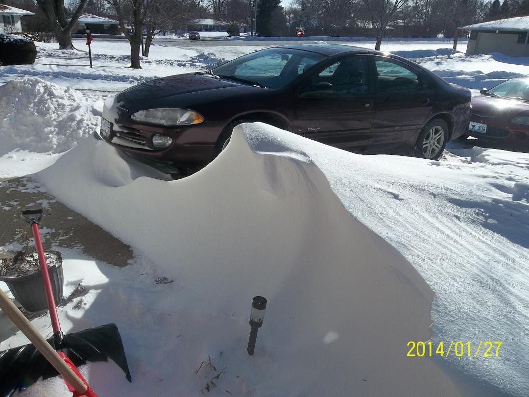 Drifted snow over our sidewalk