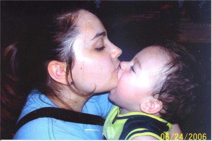 Xander is using Mom's chin as a bottle. OUCH