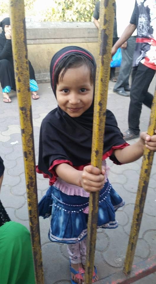 City kid hanging around laundry