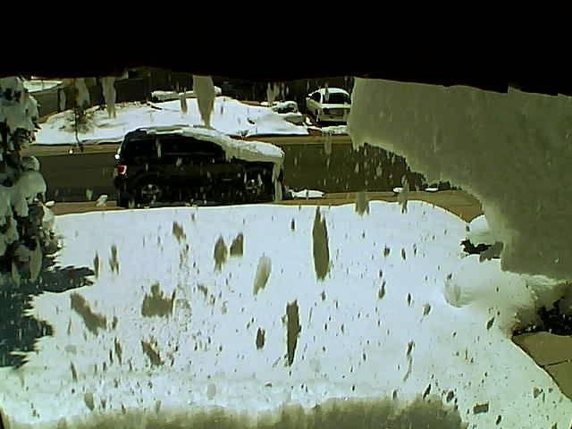 Solar Avalanche - When the snow accumulated on the solar panels suddenly breaks loose and lands on the front yard.