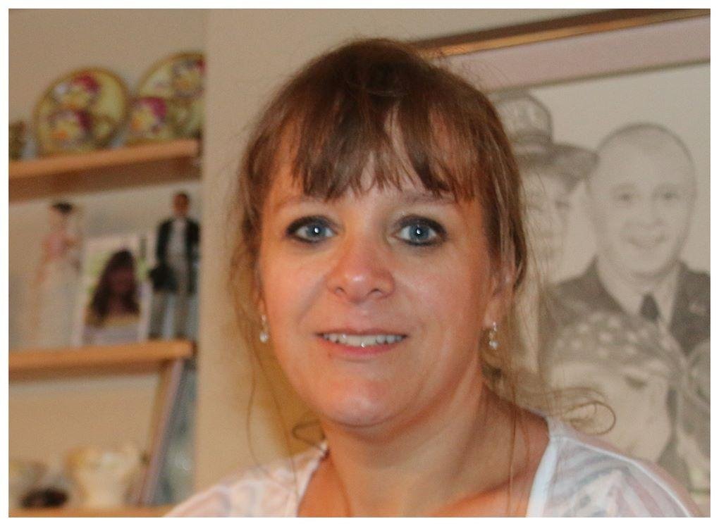 Our Daughter Jyl and one of her pencil art work in the back ground. She is the real artist in this family. Her specialties  is portrait art. I wish she would do more of it. Say one of Marlene and me.. I could see the skill 