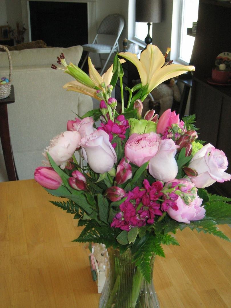 Mom got her flowers. They look great. Right after they got here I had her come over from watching Alex and Paige. Almost forgot to mention, mom added the lilies.