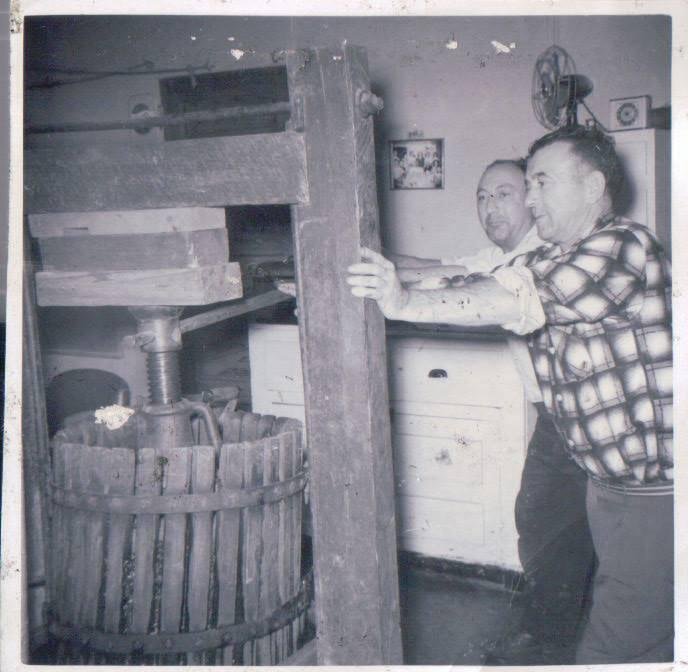 My Dad & Uncle Jim pressing grapes/making wine in our basement back in 1958.