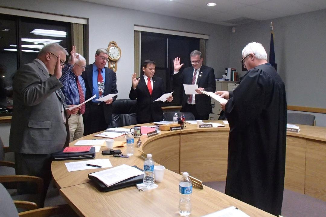 Magistrate David K. Plummer administering the oath of office to (l-r) Karl Beichler, Michael Mould, David Thorne, Joe Strauch and Joe Ross