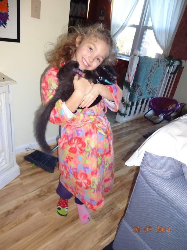 Hannah wearing robe made by Deb Rafferty for Christmas 2013. She is holding Yoda, one of their new kittens.