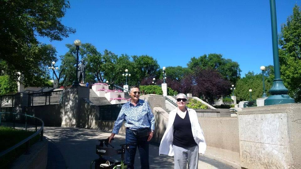 My sister, Peggy Wright and her friend Phil at the foot of the stairway up to the Legislature from the river.