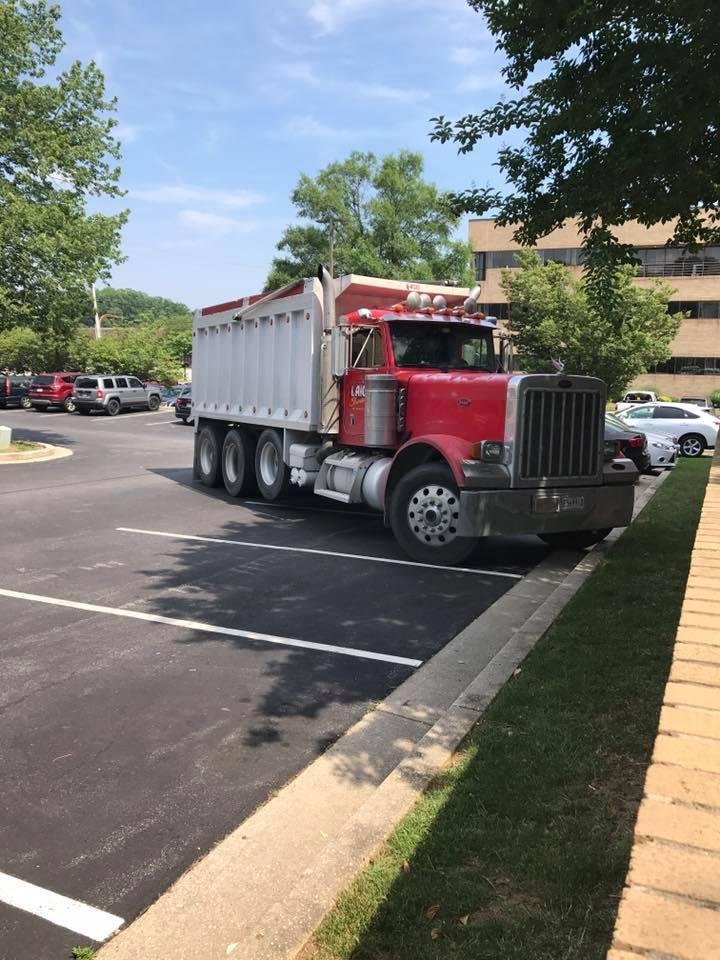 He's only taking up two spots. So when you park your jeep or pickup truck, you have no excuse to take up more than one!!!
But seriously, I wasn't expecting this huge truck when I walked outside. We usually don't see these