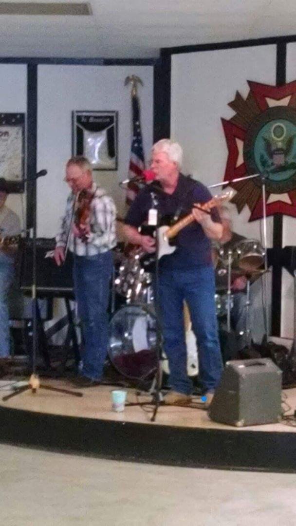 Brother Delbert singing at Renstrom memorial.