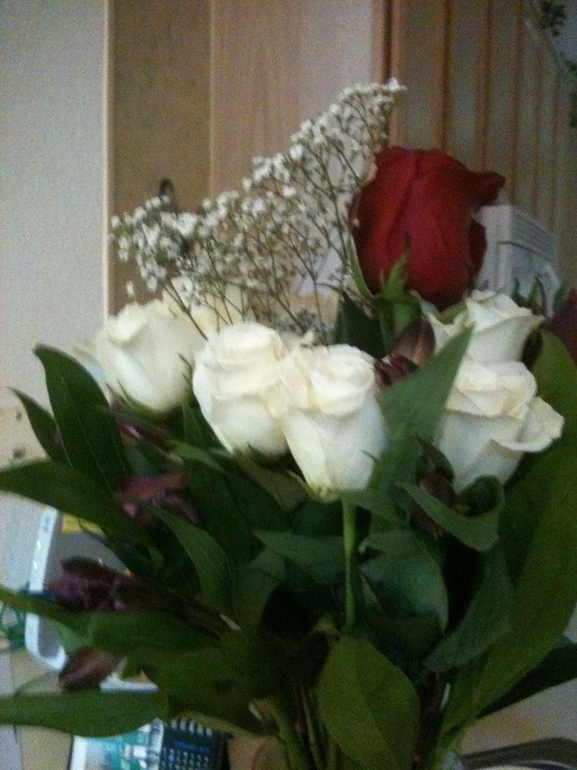 Beautiful white roses with a sensual card from my husband. Red rosé, box of candy and a card from me to hubby... Complete day.... almost...