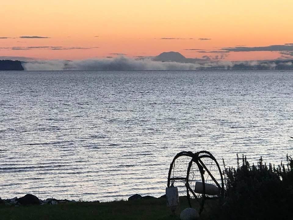 Good morning! Aberdeen is behind the low hanging clouds with Mt Rainier in background.