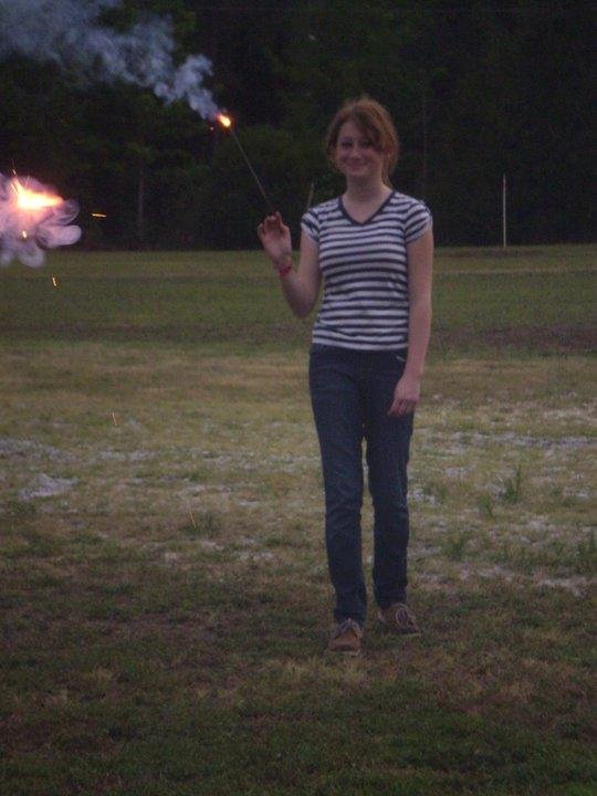 Meaghan is really trying to have fun with the sparklers